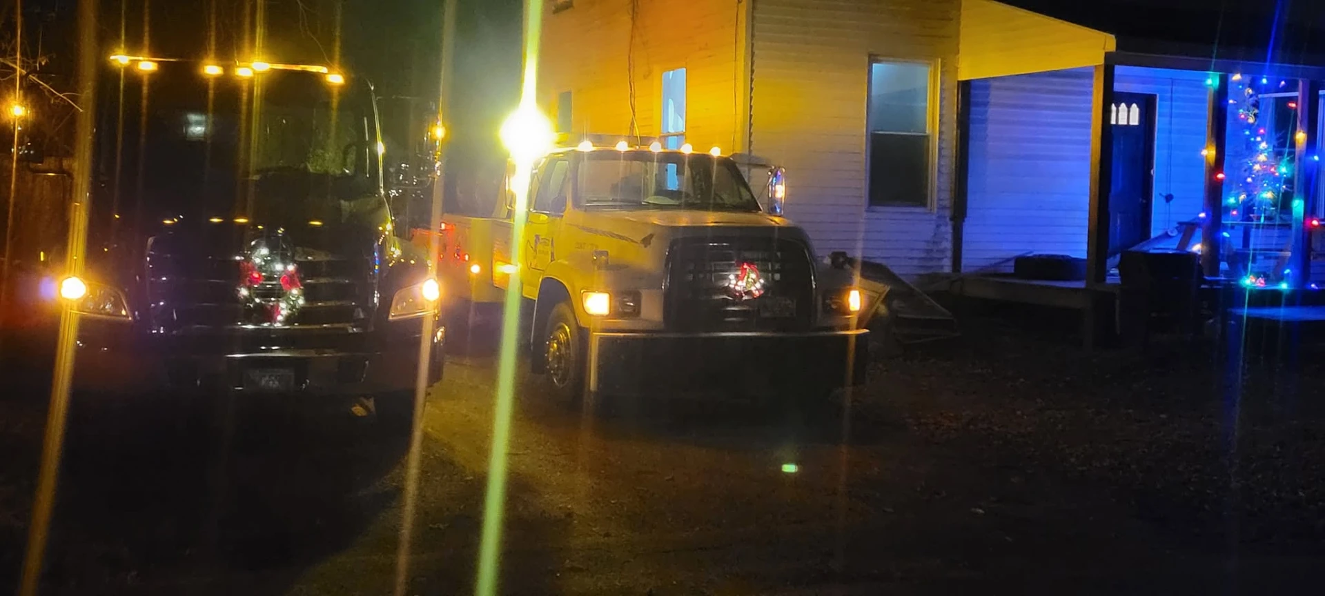 Liberty Towing trucks staged and ready at night